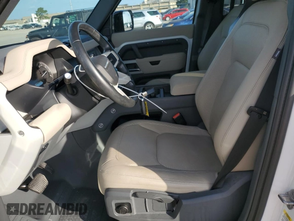 2023 Land Rover Defender S with VIN SALEJ7EXXP2124527, listed as a Copart auction lot 64578725 with 33,816 mi miles and Salvage title. Bid and sale history available at DreamBid. Image 7.