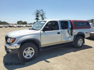 2002 Toyota Tacoma PreRunner with VIN 5TEGN92N52Z107318, listed as a Copart auction lot 57454915 with 151,004 mi miles and Salvage title. Bid and sale history available at DreamBid. Image 1.