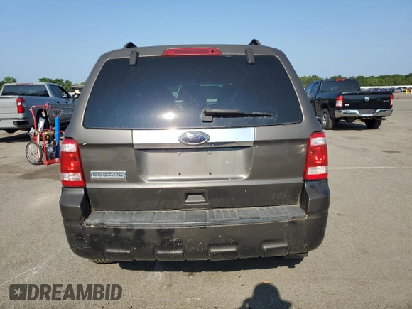 2011 Ford Escape Hybrid with VIN 1FMCU4K35BKA16469, listed as a Copart auction lot 65811905 with 401,583 mi miles and Clean title. Bid and sale history available at DreamBid. Image 6.
