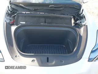 2023 Tesla Model Y Long Range z VIN 7SAYGDEE0PA128888, wystawiony jako IAAI lot #41410085 z przebiegiem 12 578 mil mil oraz . Historia ofert i sprzedaży dostępna na DreamBid. Obrazek 10.