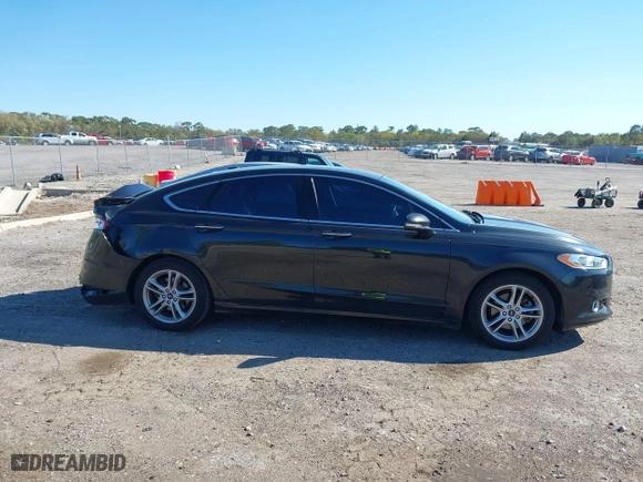 2015 Ford Fusion Titanium Hybrid with VIN 3FA6P0RUXFR119698, listed as a IAAI auction lot 41791411 with 140,646 mi miles. Bid and sale history available at carsss.com. Image 14.