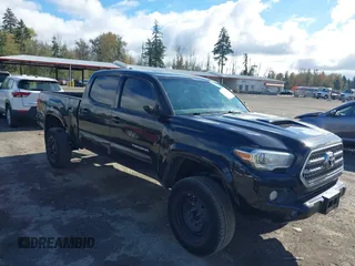 2016 Toyota Tacoma SR5 with VIN 5TFDZ5BN7GX001869, listed as a IAAI auction lot 40610002 with 184,380 mi miles. Bid and sale history available at carsss.com. Image 1.