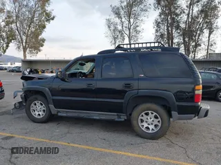 2004 Chevrolet Tahoe LS with VIN 1GNEK13T64R265302, listed as a IAAI auction lot 41445237 with 242,840 mi miles. Bid and sale history available at carsss.com. Image 14.
