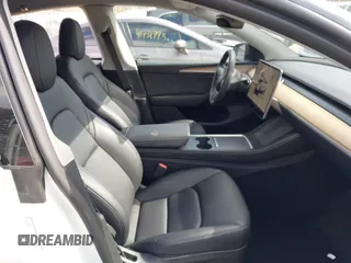 2023 Tesla Model Y Long Range with VIN 7SAYGDEE7PF832007, listed as a IAAI auction lot 41751598 with 14,126 mi miles and . Bid and sale history available at DreamBid. Image 5.