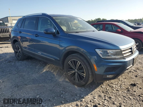 2018 Volkswagen Tiguan SEL with VIN 3VV3B7AX1JM034279, listed as a Copart auction lot 60402155 with 91,751 mi miles and Salvage title. Bid and sale history available at DreamBid. Image 4.