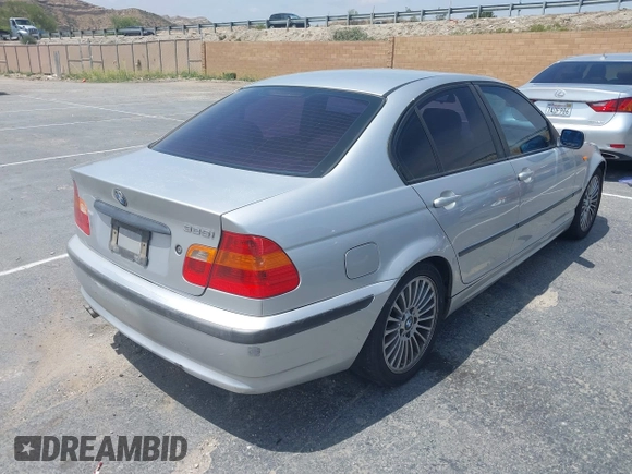 2002 BMW 3 Series 325i with VIN WBAET37452NG73105, listed as a IAAI auction lot 42105774 with 202,852 mi miles. Bid and sale history available at carsss.com. Image 4.