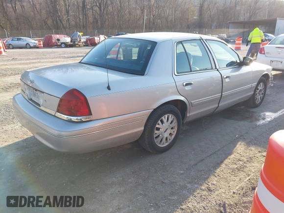 2005 Ford Crown Victoria LX z VIN 2FAFP74W85X121984, wystawiony jako IAAI lot #41427678 z przebiegiem 113 437 mil mil oraz . Historia ofert i sprzedaży dostępna na DreamBid. Obrazek 4.