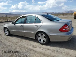 2004 Mercedes-Benz E-Class 5.0L with VIN WDBUF70J54A496963, listed as a Copart auction lot 64214634 with 113,575 mi miles and Salvage Title. Bid and sale history available at carsss.com. Image 2.
