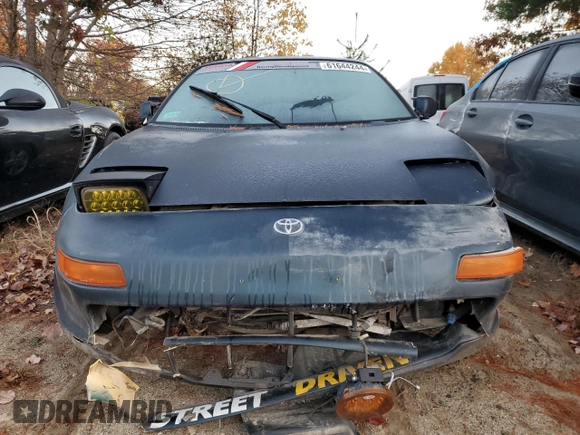 1991 Toyota MR2 z VIN JT2SW22M2M0010031, wystawiony jako Copart lot #61644244 z przebiegiem 74 912 mil mil oraz Nie do naprawy • Non repairable. Historia ofert i sprzedaży dostępna na DreamBid. Obrazek 5.