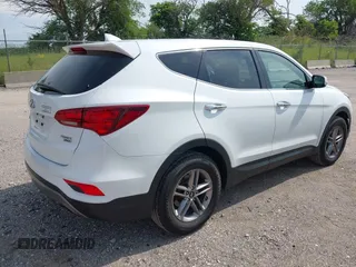 2017 Hyundai Santa Fe 2.4L with VIN 5NMZTDLB5HH018198, listed as a IAAI auction lot 42523632 with 144,883 mi miles and . Bid and sale history available at DreamBid. Image 4.