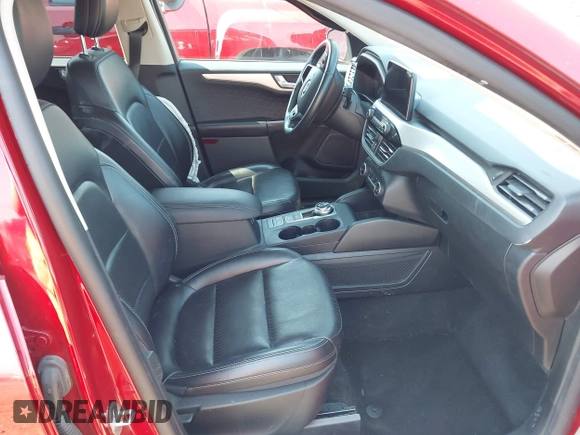 2020 Ford Escape SEL z VIN 1FMCU0H6XLUB62303, wystawiony jako IAAI lot #42646790 z przebiegiem 70 895 mil mil oraz . Historia ofert i sprzedaży dostępna na DreamBid. Obrazek 5.