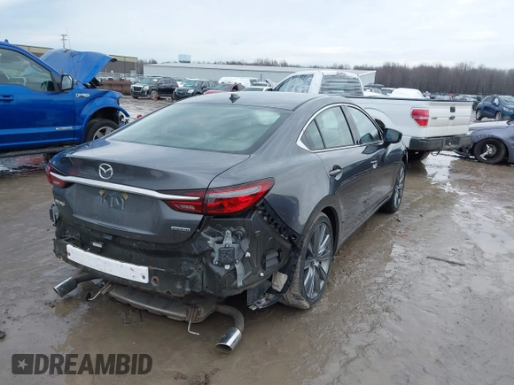 2020 Mazda 6 Grand Touring with VIN JM1GL1TYXL1524543, listed as a IAAI auction lot 41474337 with 52,160 mi miles and . Bid and sale history available at DreamBid. Image 4.