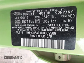 2013 Hyundai Accent SE with VIN KMHCU5AEXDU069586, listed as a IAAI auction lot 40968974 with 98,939 mi miles. Bid and sale history available at carsss.com. Image 9.