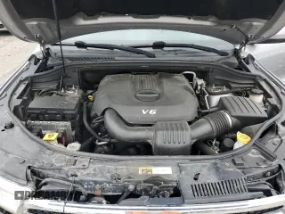 2014 Dodge Durango SXT z VIN 1C4RDJAG8EC596784, wystawiony jako Copart lot #57682215 z przebiegiem 142 008 mil mil oraz Szkoda całkowita • Salvage title. Historia ofert i sprzedaży dostępna na DreamBid. Obrazek 11.