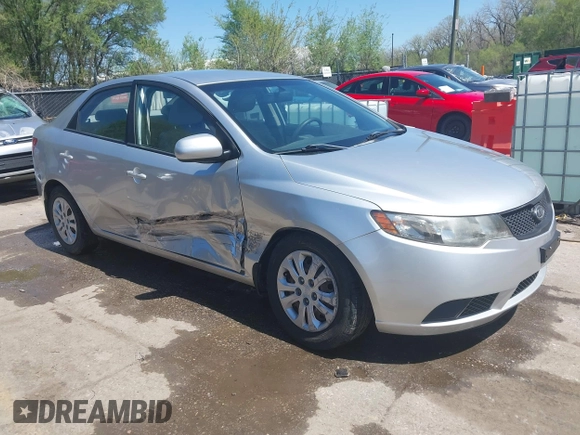 2010 Kia Forte LX with VIN KNAFT4A29A5061695, listed as a IAAI auction lot 42034559 with 114,470 mi miles. Bid and sale history available at carsss.com. Image 1.