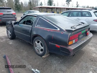 1986 Nissan 300ZX z VIN JN1HZ14S4GX140955, wystawiony jako IAAI lot #41935505 z przebiegiem 144 917 mil mil oraz . Historia ofert i sprzedaży dostępna na DreamBid. Obrazek 3.