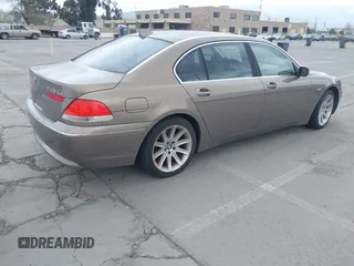 2004 BMW 7 Series 745Li with VIN WBAGN63494DS45716, listed as a IAAI auction lot 41906522 with 127,292 mi miles. Bid and sale history available at carsss.com. Image 4.