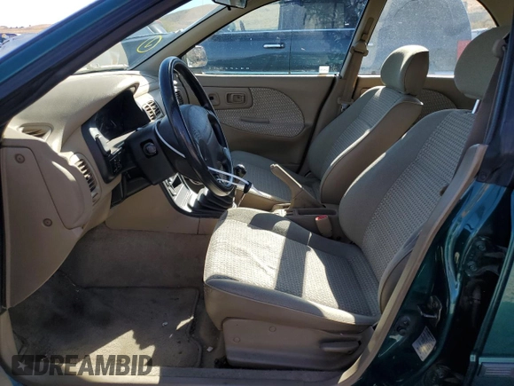 1997 Subaru Impreza L with VIN JF1GF4352VG821519, listed as a Copart auction lot 76420034 with 57,600 mi miles and Clean title. Bid and sale history available at DreamBid. Image 7.