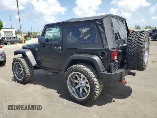 2014 Jeep Wrangler Sport with VIN 1C4AJWAG1EL200181, listed as a Copart auction lot 61165595 with 101,234 mi miles and Salvage title. Bid and sale history available at DreamBid. Image 2.