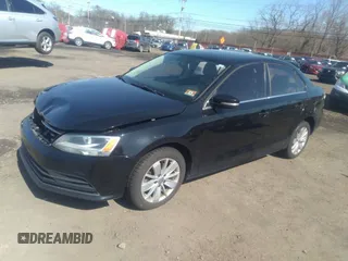 2016 Volkswagen Jetta Sedan 1.4T SE with VIN 3VWD67AJXGM242539, listed as a IAAI auction lot 38948493 with 121,876 mi miles. Bid and sale history available at carsss.com. Image 2.
