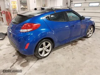 2014 Hyundai Veloster with VIN KMHTC6AD4EU196870, listed as a IAAI auction lot 41207663 with 119,252 mi miles. Bid and sale history available at carsss.com. Image 4.
