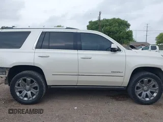 2015 GMC Yukon Denali z VIN 1GKS1CKJ3FR713531, wystawiony jako IAAI lot #41866691 z przebiegiem 157 666 mil mil oraz . Historia ofert i sprzedaży dostępna na DreamBid. Obrazek 14.