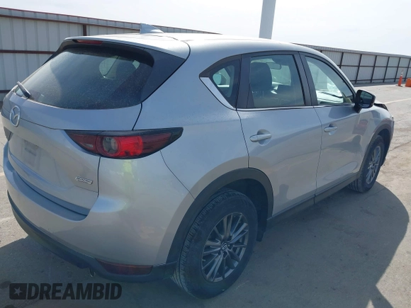 2019 Mazda CX-5 Sport with VIN JM3KFBBM6K1582760, listed as a IAAI auction lot 41822152 with 60,620 mi miles and . Bid and sale history available at DreamBid. Image 4.