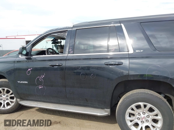 2015 GMC Yukon SLT z VIN 1GKS1BKCXFR192349, wystawiony jako IAAI lot #41842474 z przebiegiem 185 166 mil mil oraz . Historia ofert i sprzedaży dostępna na DreamBid. Obrazek 14.