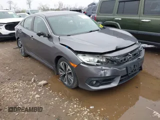 2017 Honda Civic EX-T with VIN 19XFC1F34HE014334, listed as a IAAI auction lot 42009311 with 124,717 mi miles. Bid and sale history available at carsss.com. Image 1.