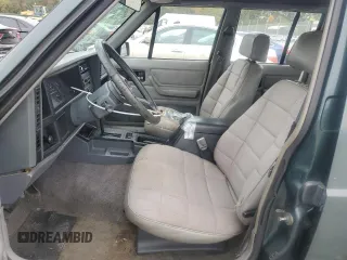 1993 Jeep Cherokee Sport with VIN 1J4FT68S4PL588241, listed as a Copart auction lot 80115884 with 204,174 mi miles and Salvage Title. Bid and sale history available at carsss.com. Image 7.