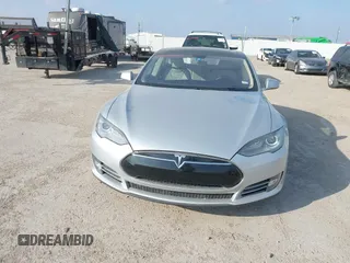 2013 Tesla Model S with VIN 5YJSA1CG3DFP28908, listed as a IAAI auction lot 41804041 with 140,756 mi miles and . Bid and sale history available at DreamBid. Image 10.
