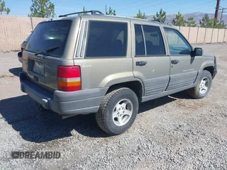 1997 Jeep Grand Cherokee Laredo with VIN 1J4GZ58S3VC603239, listed as a IAAI auction lot 42593915 with 295,696 mi miles and . Bid and sale history available at DreamBid. Image 4.