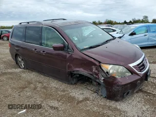 2010 Honda Odyssey Touring with VIN 5FNRL3H94AB056657, listed as a Copart auction lot 72658934 with 202,690 mi miles and Salvage title. Bid and sale history available at DreamBid. Image 4.