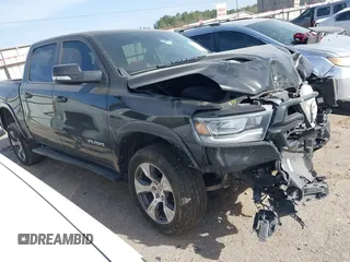 2021 Ram 1500 Laramie z VIN 1C6SRFJT4MN799792, wystawiony jako IAAI lot #41838329 z przebiegiem 106 968 mil mil oraz . Historia ofert i sprzedaży dostępna na DreamBid. Obrazek 1.