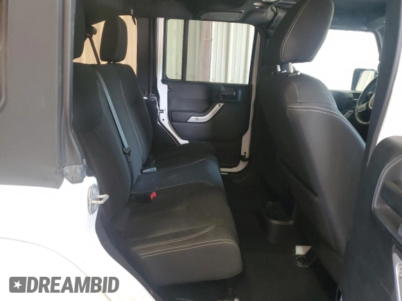 2016 Jeep Wrangler Unlimited Sahara with VIN 1C4BJWEGXGL310499, listed as a Copart auction lot 59756015 with 128,498 mi miles and Salvage title. Bid and sale history available at DreamBid. Image 10.