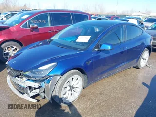 2021 Tesla Model 3 Long Range with VIN 5YJ3E1EB6MF990089, listed as a IAAI auction lot 41607316 with 25,223 mi miles and . Bid and sale history available at DreamBid. Image 2.