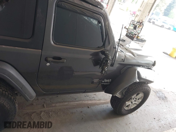2020 Jeep Wrangler Willys z VIN 1C4GJXAG4LW237057, wystawiony jako IAAI lot #42044223 z przebiegiem 54 802 mil mil oraz . Historia ofert i sprzedaży dostępna na DreamBid. Obrazek 14.