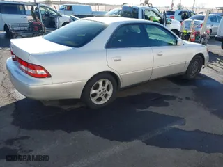 2000 Lexus ES 300 with VIN JT8BF28G9Y0282007, listed as a IAAI auction lot 41702668 with 154,025 mi miles. Bid and sale history available at carsss.com. Image 4.