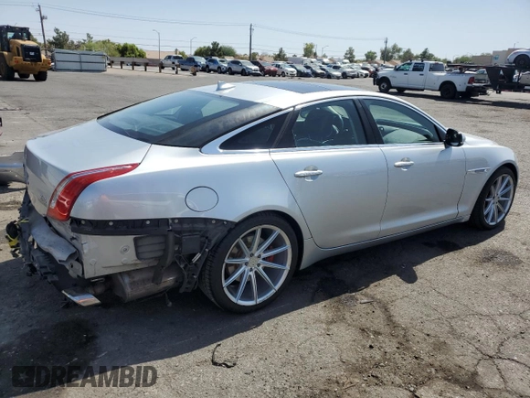 2015 Jaguar XJ with VIN SAJWJ1CD4F8V82496, listed as a Copart auction lot 71013474 with 52,744 mi miles and Salvage title. Bid and sale history available at DreamBid. Image 3.