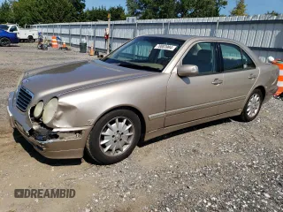 2000 Mercedes-Benz E-Class with VIN WDBJF65J2YB165568, listed as a Copart auction lot 70003994 with 146,518 mi miles and Salvage Title. Bid and sale history available at carsss.com. Image 1.