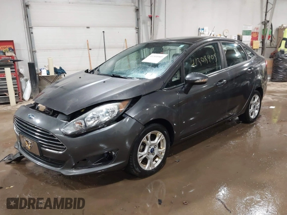 2015 Ford Fiesta SE with VIN 3FADP4BJ9FM164093, listed as a IAAI auction lot 41308905 with 75,839 mi miles. Bid and sale history available at carsss.com. Image 2.