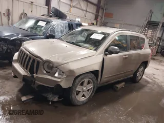 2010 Jeep Compass Sport with VIN 1J4NF4FB7AD501587, listed as a IAAI auction lot 41514419 with 154,826 mi miles. Bid and sale history available at carsss.com. Image 2.
