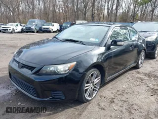 2011 Scion tC with VIN JTKJF5C74B3014552, listed as a IAAI auction lot 42004369 with 232,588 mi miles. Bid and sale history available at carsss.com. Image 2.