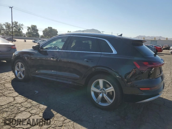 2019 Audi e-tron Premium Plus with VIN WA1LAAGE5KB023079, listed as a Copart auction lot 64977463 with 14,043 mi miles. Bid and sale history available at carsss.com. Image 2.