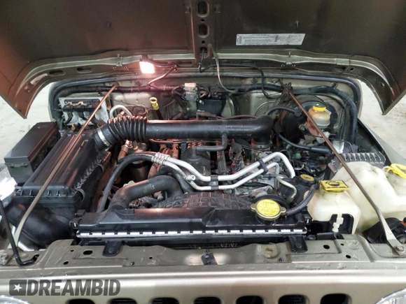 2003 Jeep Wrangler Rubicon z VIN 1J4FA69S13P345591, wystawiony jako Copart lot #41741685 z przebiegiem 85 335 mil mil oraz Szkoda całkowita • Salvage title. Historia ofert i sprzedaży dostępna na DreamBid. Obrazek 13.