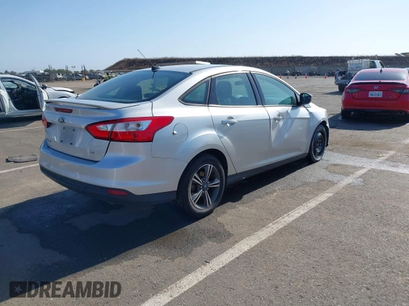 2012 Ford Focus SE z VIN 1FAHP3F28CL215997, wystawiony jako IAAI lot #42483639 z przebiegiem 101 518 mil mil oraz . Historia ofert i sprzedaży dostępna na DreamBid. Obrazek 4.