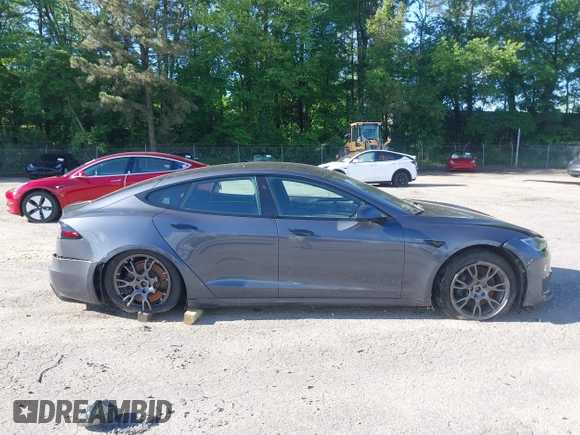 2022 Tesla Model S with VIN 5YJSA1E57NF479056, listed as a IAAI auction lot 42091009 with 78,272 mi miles and . Bid and sale history available at DreamBid. Image 13.