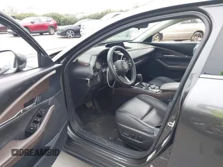 2022 Mazda CX-30 S Premium with VIN 3MVDMBDL9NM434619, listed as a IAAI auction lot 41620655 with 46,557 mi miles and . Bid and sale history available at carsss.com. Image 5.