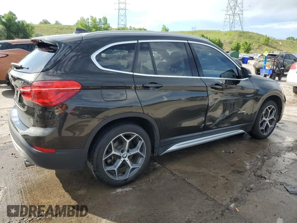 2017 BMW X1 xDrive28i with VIN WBXHT3C32H5F71690, listed as a Copart auction lot 60852375 with 67,475 mi miles and Salvage title. Bid and sale history available at DreamBid. Image 3.