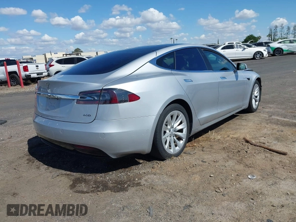 2016 Tesla Model S 90D with VIN 5YJSA1E22GF174637, listed as a IAAI auction lot 42234083 with 142,915 mi miles and . Bid and sale history available at DreamBid. Image 4.